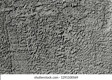 Textured Wall Plaster or Stucco of Drywall on Building in Hard Light