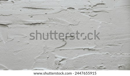 Textured white coating made using plaster