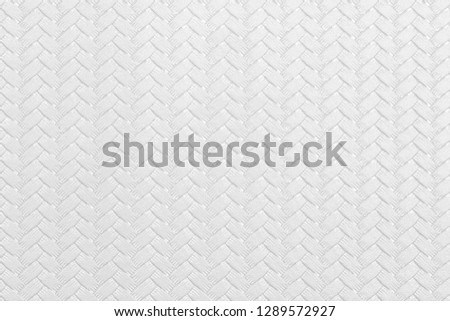 Textured white leather background with wickerwork cable pattern