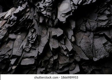 Textures and patterns of basalt volcanic rock formations at Hálsanefshellir Cave next to the Reynisfjara black sand beach, Iceland - Shutterstock ID 1866989953