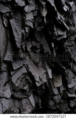 Textures and patterns of basalt volcanic rock formations at Hálsanefshellir Cave 
next to the Reynisfjara black sand beach, Iceland