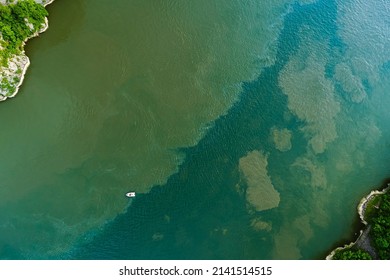 Textures Of Water. Aerial View Of The Place Where Two Rivers With Different Composition Merge.