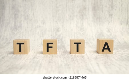 TFTA - Tripartite Free Trade Area Acronym On Wooden Blocks