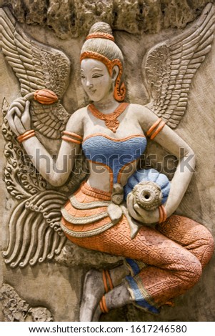Thai ancient stone carving color lady 