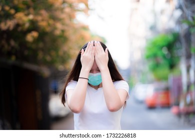 Thai Asian teenage women are worried about financial situation in economic recession due to corona pneumonia outbreak. Person use hands to hold head from unceasing thoughts and reduce salary of work. - Shutterstock ID 1732226818