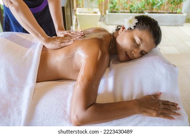 Thai Asian Women Get Thai Massage At A Luxury Resort In Thailand. 