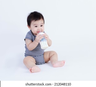 Thai baby drinking milk isolated 