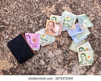 Thai Baht Money With Wallet On Dirty Floor