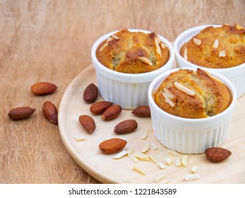 Thai Bannana Cake  With Almon Slice On White Bowl Dishes  On Wood Table.
