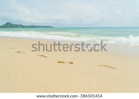 Thai beach, wave and footsteps
