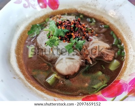 Thai Boat noodles soup or Guay tiew reua ,Rice noodles thicken soup with stewed pork , pork ball ,Braised pork and liver pork ,Thai boat noodles is Thailand's most famous noodles soup,
Thai local food