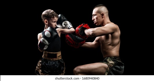 Thai Boxing Coach Practicing Punches With His Student. Kickboxing Concept, Mma. Mixed Media