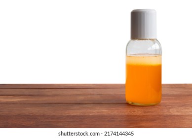 Thai Boxing Liniment (Namman Muay) on wooden table isolated on a white background. - Shutterstock ID 2174144345