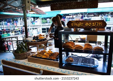 Thai Chef And Merchant People Cooking Sweet Cuisine Or Dessert Food For Sale Travelers At Local Talad Nam Lumphaya Temple Or Wat Lam Phaya Floating Market On April 9, 2022 In Nakhon Pathom, Thailand