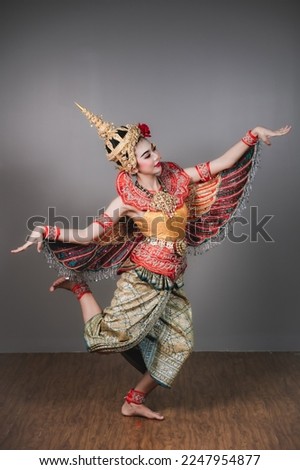 Thai classical dance performance Manohra Buchayan.Art culture Thailand Dancing in masked khon.Thai dance performance.Thai show.The khon portrait.Portrait gray background.Thai dacnce.thailand show.
