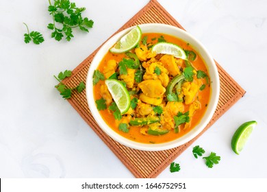 Thai Coconut Chicken Curry, White Background Top View Photo