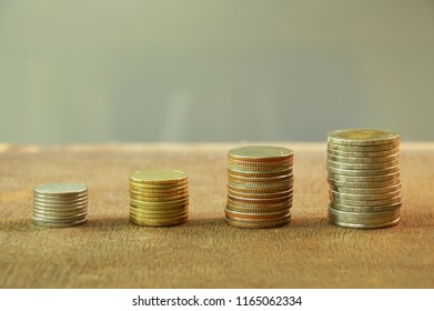 Thai coin with different size arranging on wooden board - Shutterstock ID 1165062334