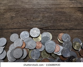 Thai coins on old wood background