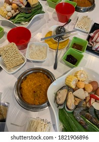 Thai Cuisine: Steamboat That Consists Of Tomyam, Noodles, Mushroom, Meat And Varieties Of Seafood.