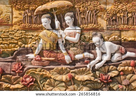 Thai culture stone carving on temple wall