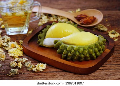 Thai Dessert : Durian Mochi Or Moon Cake Served With Chrysanthemum Tea. Durian Daifuku On Wood Chop, Moon Cake For Mid Autumn Festival, Chinese Happy New Year And Moon Festival. Still Life In Studio.