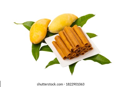 Thai Dessert Mango Sheet ,Sun Dried Mango Paste Roll And Mango Fruit Isolated On White Background.with Clipping Path.