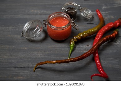 Thai Dish - Hot Sauce Made Of Sriracha Pepper On A Dark Background. Horizontal Orientation