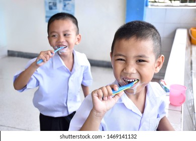 Thai Elementary School Students Are Brushing Their Teeth After Eating Lunch Every Day For Good Oral And Dental Health.