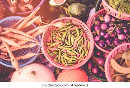 Thai exotic food in street food market with vegetable and fruit. Like the charming people, exotic foods greets you on almost every corner in Thailand. with vintage filter - Shutterstock ID 476664901