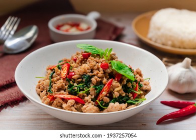 Thai famous food -  Stir-fried basil with minced pork hot and spicy taste serving with jasmine rice and fish sauce