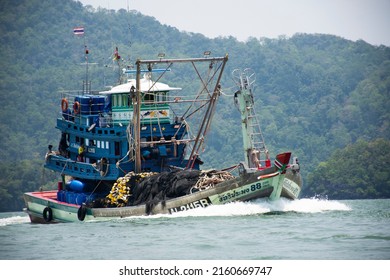 Thai fisher people sailing fishing boat ship in sea after catch fish and marine life in ocean of Phetra National Park to waterfront Pak Bara village at La ngu city on April 12, 2022 in Satun, Thailand