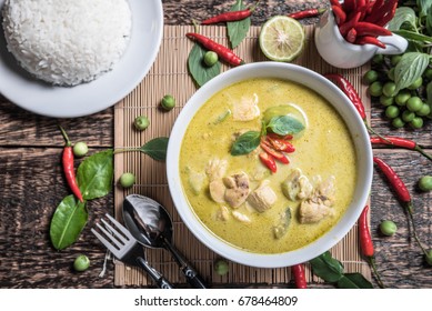 Thai food  chicken green curry on old wooden background, Top view.