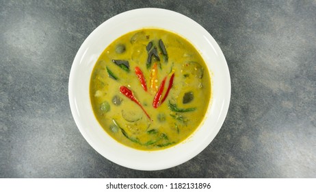 Thai food. Green Curry with Chicken on stone background. Top view, Copy space for design. 