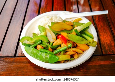 Thai Food Served On A Paper Plate Outdoors