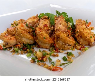 Thai food - Shrimps fried with chilies  garlic and salt on white plate