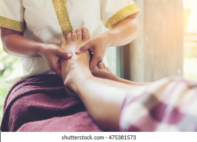 Thai Foot Massage Alternative Medicine Therapy With Thai Herb Aroma Oil ,background For Spa Or Alternative Medical Therapy Concept.