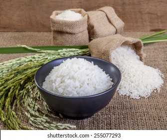 Thai Fragrant Jasmine Rice In A Bowl, With A Garnish Of Thai Basil Which Is In Flower.