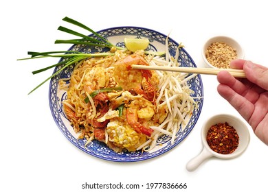 Thai Fried Noodles "Pad Thai" with shrimps or prawns, isolated on white background
