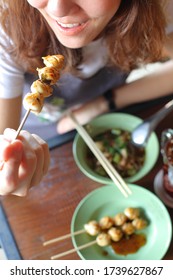 Thai Girl Eating Thai Street Food