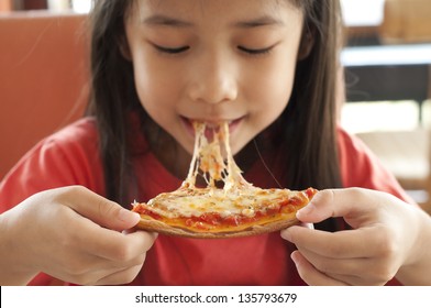 Thai Girl Enjoy Eating Pizza.