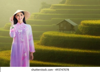 Thai girls with Ao Dai, Vietnam traditional dress with Rice terraces on 
background
