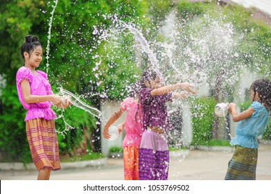 Thai Girls Children Playing Water In Songkran Festival With Thai Period Dress