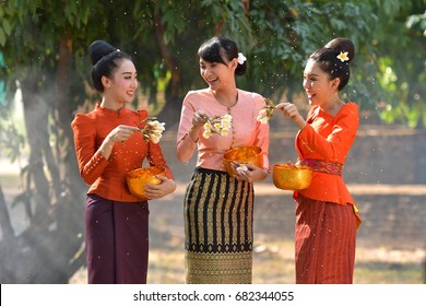 Thai girls and laos girls splashing water during festival Songkran festival