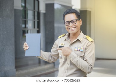 Thai Government Officials In Official Uniform Smile