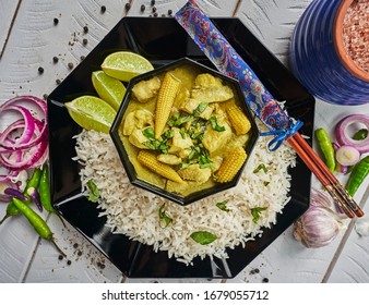 Thai Green Curry On A Distressed White Background Shot From Above                               