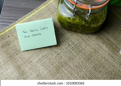 Thai Green Curry Paste In A Glass Jar On A Rustic Napkin