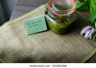 Thai Green Curry Paste In A Glass Jar On A Rustic Napkin