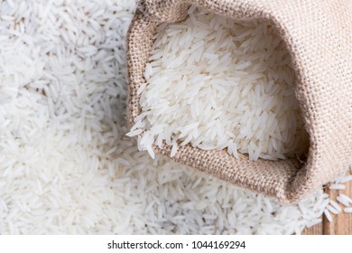 Thai jasmine rice in sack with selective focus, food background - Shutterstock ID 1044169294