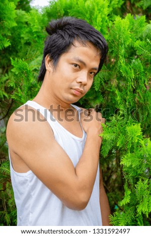 Portrait of a young man in the bamboo jungle