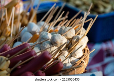 Thai meatball on wooden stick at street food market in Thailand, delicious street food, close up